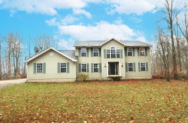 colonial home with a front yard