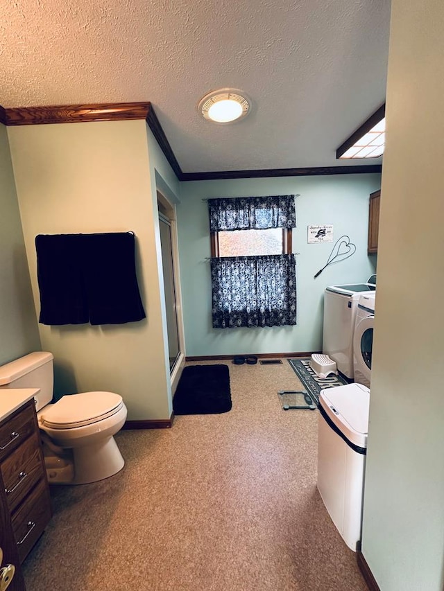 7958 Auburn Center Rd, Shelby, OH 44875 - full bath featuring washing machine and dryer, crown molding, toilet, a shower stall, and a textured ceiling
