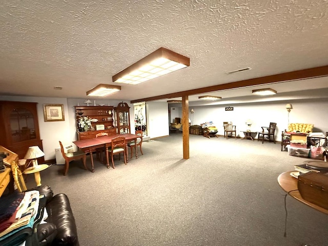 7958 Auburn Center Rd, Shelby, OH 44875 - finished basement with carpet floors, a textured ceiling, and visible vents