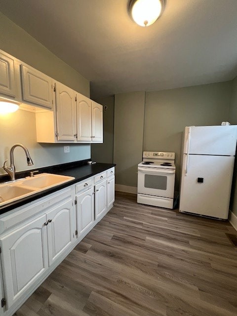 379 S Main St, Mansfield, OH 44902 - kitchen with white appliances, a sink, white cabinets, and dark wood-style flooring