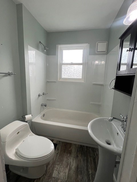 379 S Main St, Mansfield, OH 44902 - full bath with shower / washtub combination, toilet, and wood finished floors