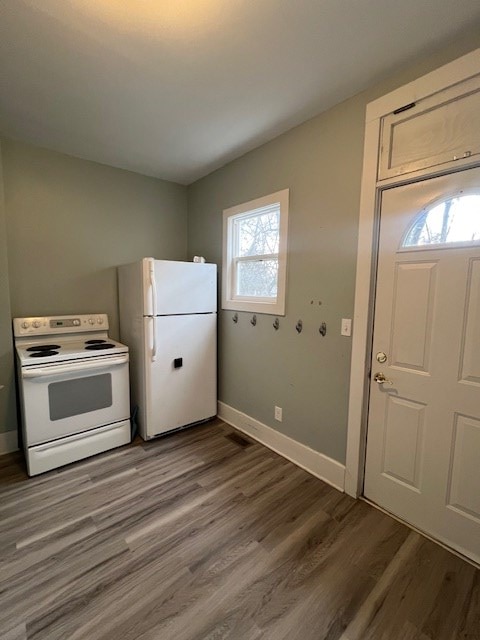 379 S Main St, Mansfield, OH 44902 - kitchen with white appliances, baseboards, and wood finished floors