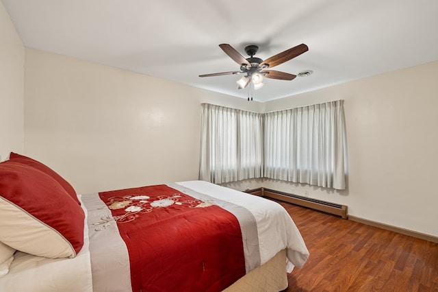 bedroom featuring ceiling fan, a baseboard radiator, and hardwood / wood-style flooring