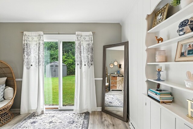 1369 Wilging Dr 1367, Mansfield, OH 44907 - doorway to outside featuring light wood-style floors and baseboards