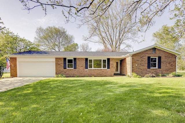 42 Kester Dr, Mount Vernon, OH 43050 - ranch-style home with an attached garage, brick siding, concrete driveway, and a front lawn