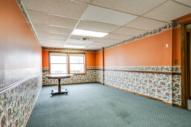 15 W Main St, Lexington, OH 44904 - carpeted empty room with a drop ceiling, wallpapered walls, and wainscoting