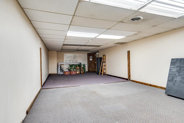 15 W Main St, Lexington, OH 44904 - below grade area featuring carpet floors, a paneled ceiling, and baseboards