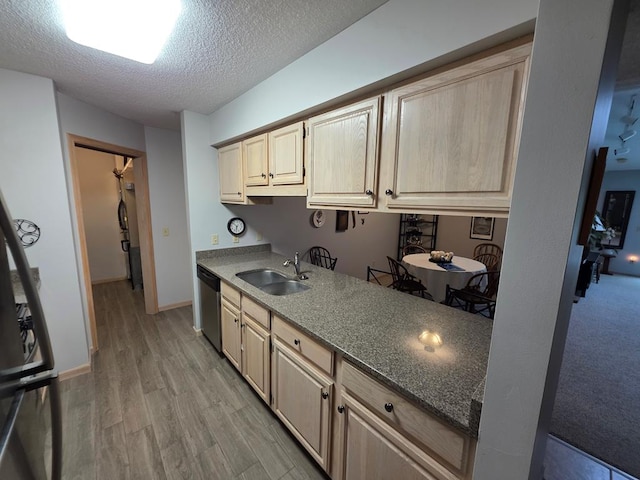 1683 Riva Ridge Dr, Mansfield, OH 44904 - kitchen with stainless steel dishwasher, a textured ceiling, light wood-style flooring, light brown cabinetry, and stone countertops