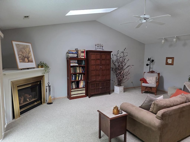 1683 Riva Ridge Dr, Mansfield, OH 44904 - living room featuring carpet, lofted ceiling, a skylight, a glass covered fireplace, and ceiling fan