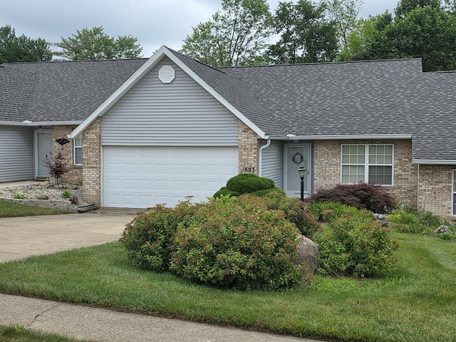 1683 Riva Ridge Dr, Mansfield, OH 44904 - single story home with a garage, a shingled roof, brick siding, driveway, and a front yard