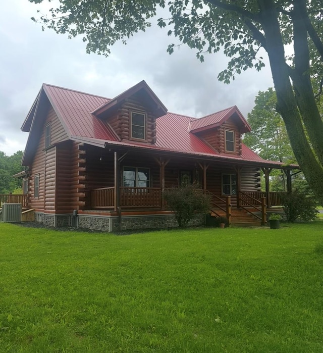 7402 Smokey Rd, Berlin Heights, OH 44814 - view of front of home featuring log siding, central AC unit, metal roof, and covered porch