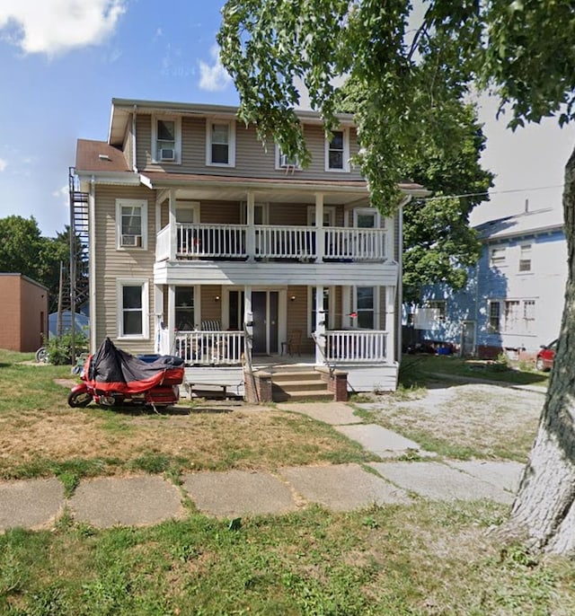42 E E Columbia St, Alliance, OH 44601 - view of front of house with a balcony and a porch
