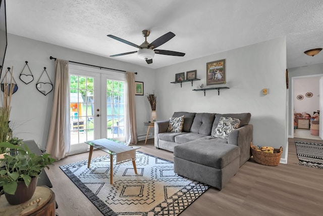 62 Brushwood Dr, Mansfield, OH 44907 - living room with a ceiling fan, wood finished floors, a textured ceiling, french doors, and baseboards