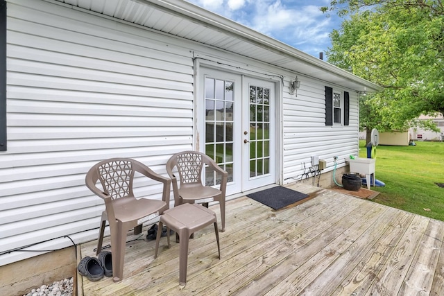 62 Brushwood Dr, Mansfield, OH 44907 - wooden terrace with french doors and a lawn