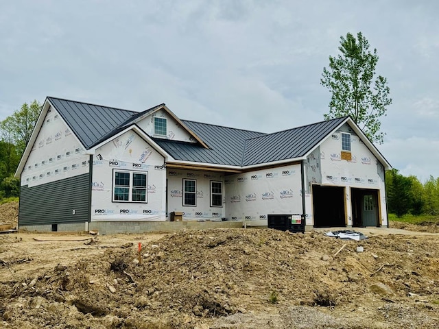 79 Hickey, Savannah, OH 44837 - unfinished property featuring a standing seam roof, metal roof, and a porch
