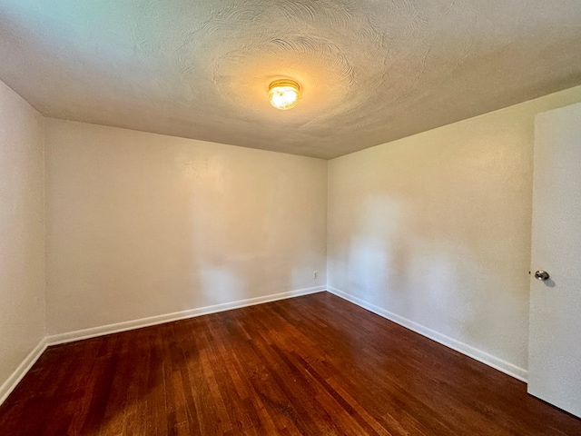 184 Mason St, Mansfield, OH 44902 - spare room featuring dark wood-style flooring and baseboards