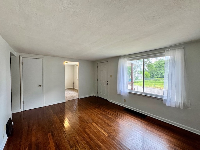 184 Mason St, Mansfield, OH 44902 - unfurnished living room with a textured ceiling and wood-type flooring