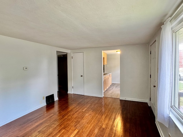 184 Mason St, Mansfield, OH 44902 - unfurnished room with wood finished floors and a textured ceiling
