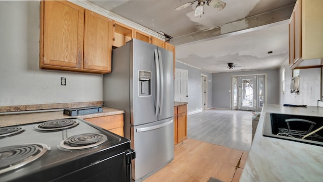 kitchen with light wood-type flooring, black appliances, open floor plan, light countertops, and ceiling fan