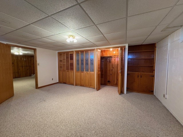 interior space with baseboards and carpet floors