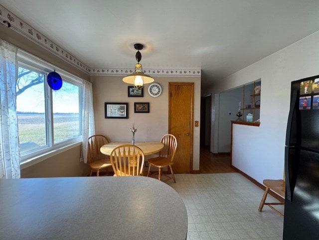 dining space with tile patterned floors