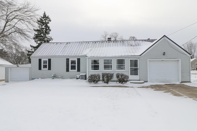 ranch-style home featuring a garage