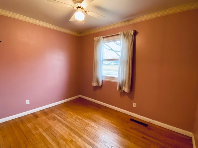 unfurnished room with ceiling fan and wood-type flooring