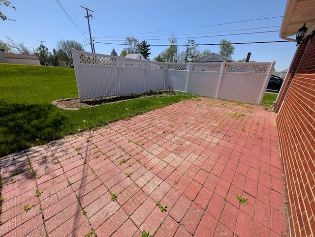 view of patio featuring fence