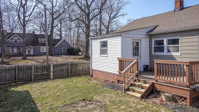 view of yard with a wooden deck and fence