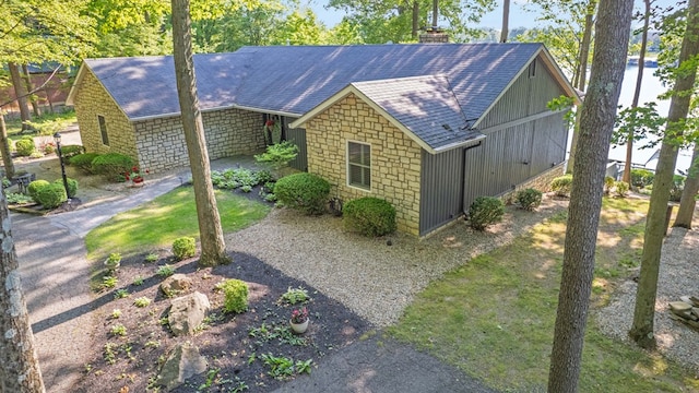 7326 State Route 19 Unit 27-30, Mount Gilead, OH 43338 - view of side of home featuring a shingled roof and a chimney