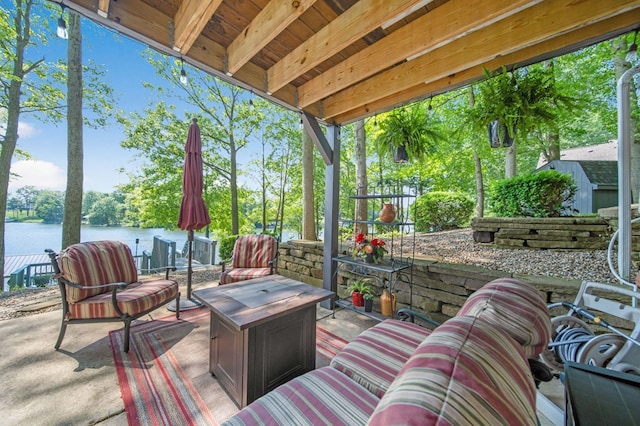 7326 State Route 19 Unit 27-30, Mount Gilead, OH 43338 - view of patio / terrace featuring a water view and an outdoor fire pit