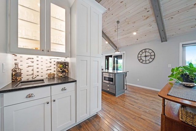 7326 State Route 19 Unit 27-30, Mount Gilead, OH 43338 - kitchen featuring backsplash, white cabinetry, light wood-type flooring, glass insert cabinets, and wood ceiling