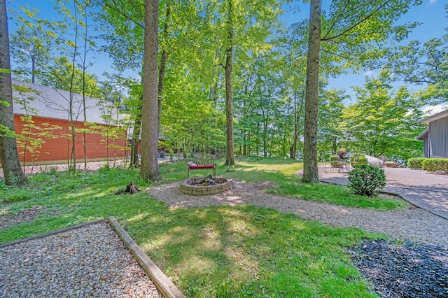 7326 State Route 19 Unit 27-30, Mount Gilead, OH 43338 - view of grassy yard featuring a fire pit and a patio area
