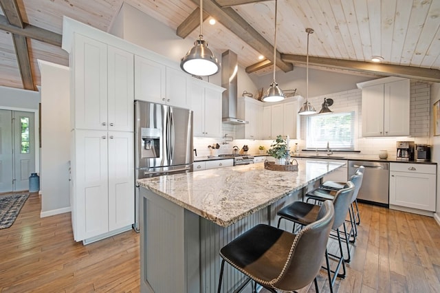 7326 State Route 19 Unit 27-30, Mount Gilead, OH 43338 - kitchen featuring appliances with stainless steel finishes, wall chimney range hood, light wood finished floors, decorative backsplash, and wooden ceiling