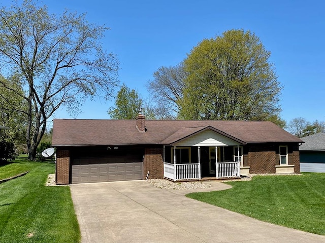 single story home with a porch, brick siding, driveway, and a garage