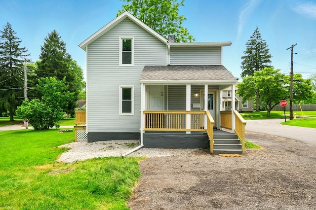 688 Mcpherson St, Mansfield, OH 44906 - view of front of property featuring a porch, a shingled roof, and a front yard