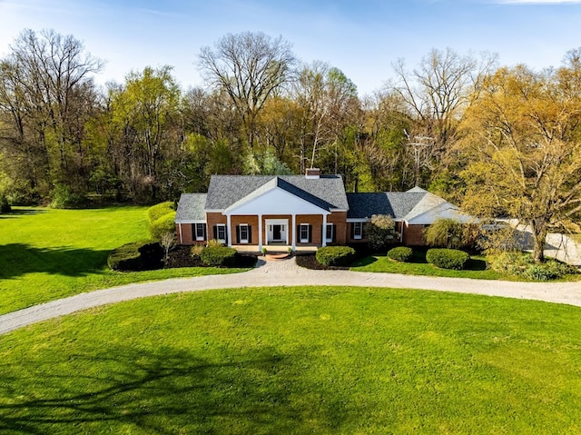 4107 State Route 113, Milan, OH 44846 - greek revival inspired property with a chimney, curved driveway, and a front yard