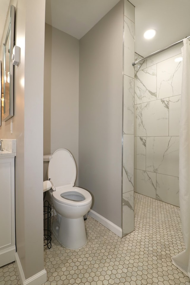 4107 State Route 113, Milan, OH 44846 - bathroom featuring baseboards, tiled shower, toilet, and vanity