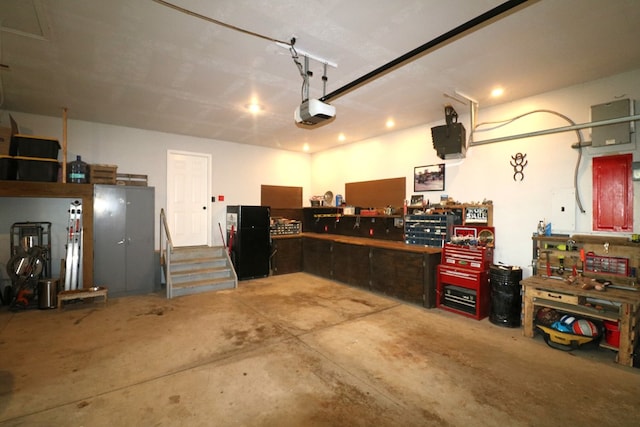 4107 State Route 113, Milan, OH 44846 - garage with a workshop area and a garage door opener