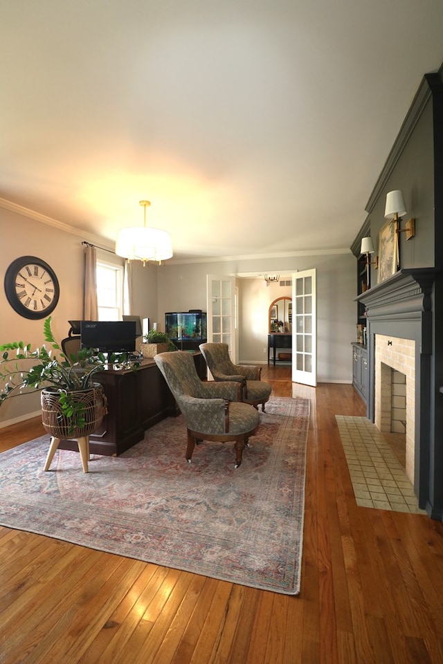 4107 State Route 113, Milan, OH 44846 - living area with a tiled fireplace, crown molding, and dark wood-type flooring