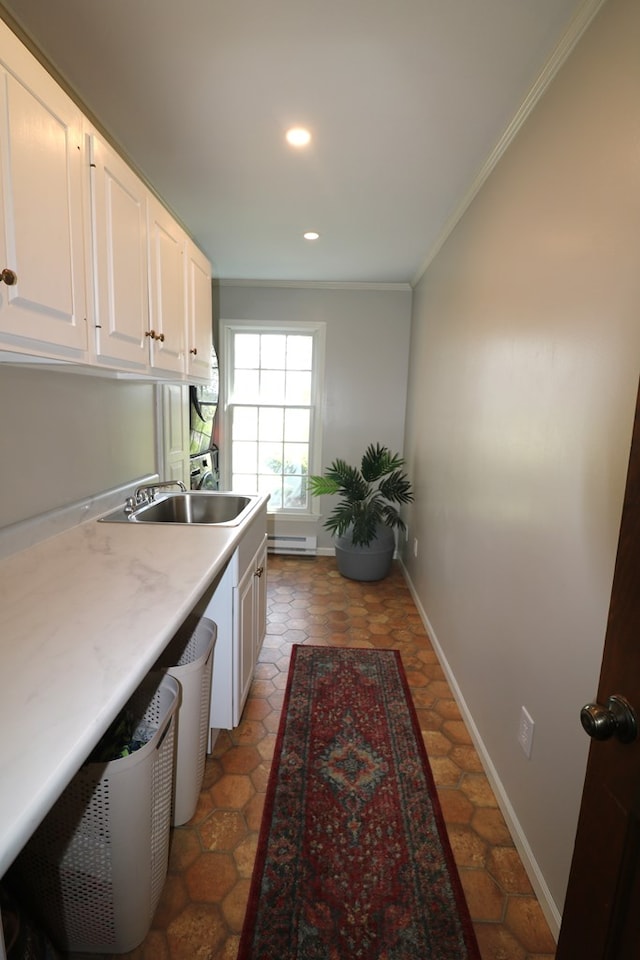4107 State Route 113, Milan, OH 44846 - interior space featuring a baseboard heating unit, a sink, cabinet space, baseboards, and ornamental molding
