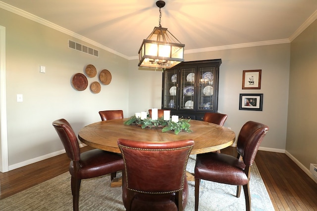 4107 State Route 113, Milan, OH 44846 - dining area featuring visible vents, wood finished floors, a chandelier, and baseboards