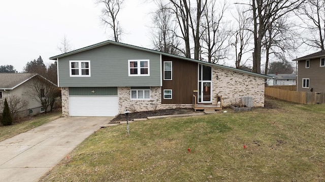 view of front of house featuring a garage and a front yard