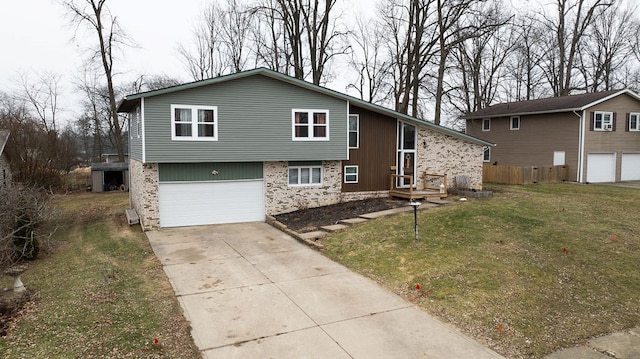 split level home featuring a garage and a front lawn