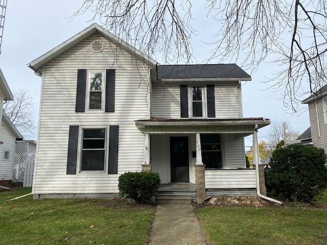 view of front of house featuring a porch and a front lawn