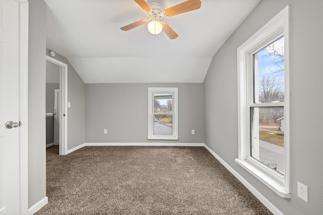 bonus room with ceiling fan, baseboards, vaulted ceiling, and carpet flooring