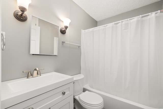 bathroom with toilet, a textured ceiling, vanity, and shower / bath combo with shower curtain