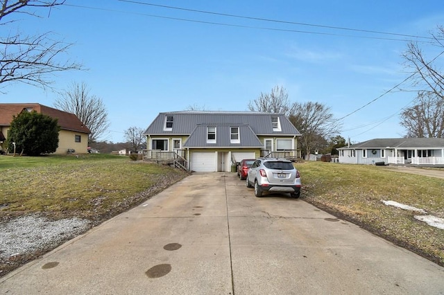 view of front facade with a garage, a front yard, and a porch