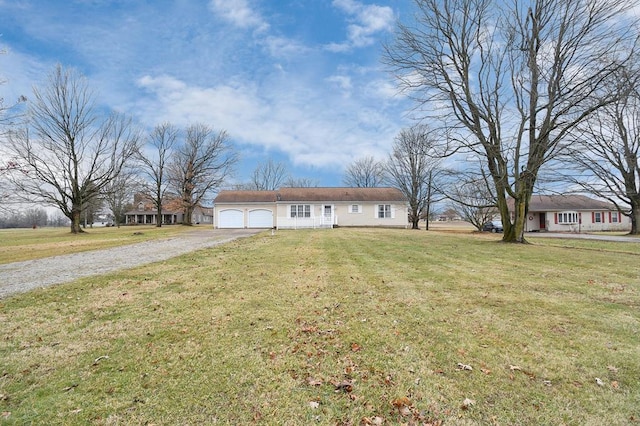 view of front of property featuring a garage and a front lawn