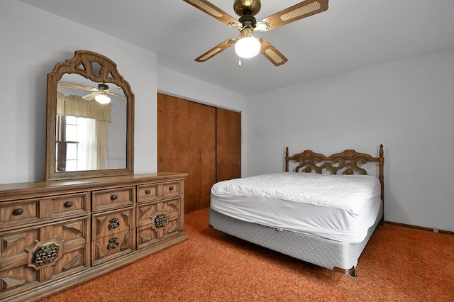 carpeted bedroom featuring a closet and ceiling fan